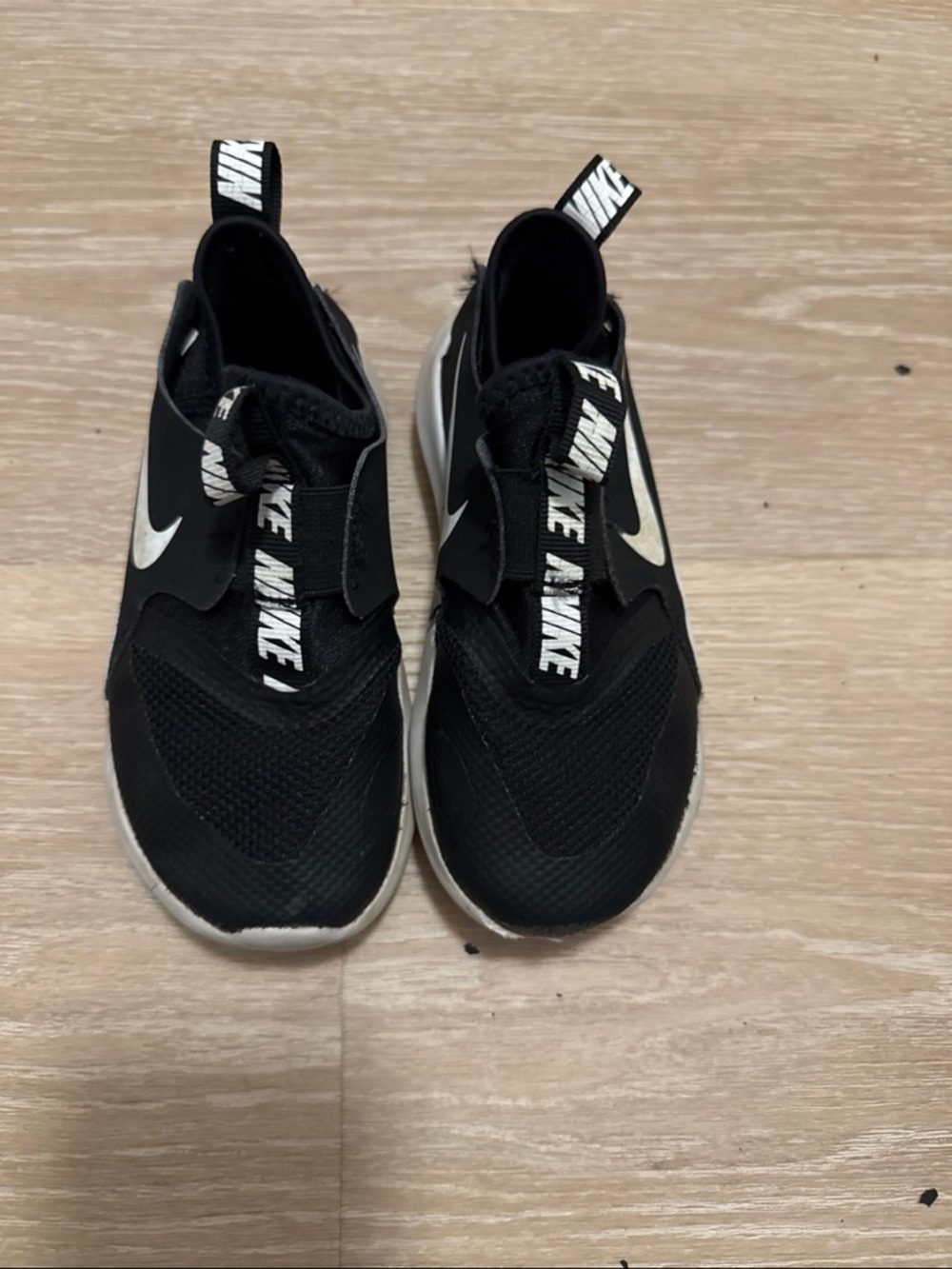 Nike Kids Black Slip-On Sneakers with White Swoosh